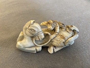 A Chinese greyish green jade 'horse and monkey' carving, probably Ming