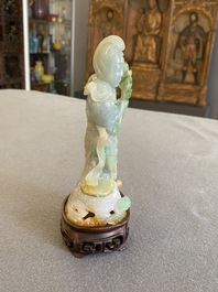 A Chinese jade sculpture of a lady on a wooden stand, Qing