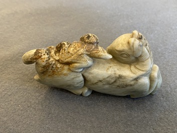 A Chinese greyish green jade 'horse and monkey' carving, probably Ming