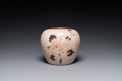 A Chinese red and black-decorated Cizhou jar with floral design, Ming