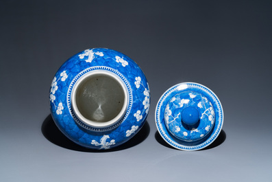 A Chinese blue and white 'prunus on cracked ice' vase and cover, Kangxi