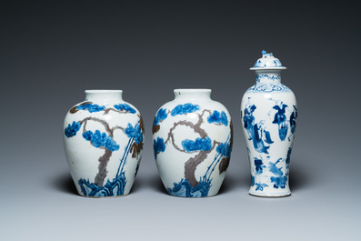 A pair of Chinese blue, white and copper-red vases, a blue and white covered vase and a Canton famille rose box and cover, 19/20th C.