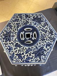 A Chinese blue and white hexagonal garden seat with floral design, 19th C.