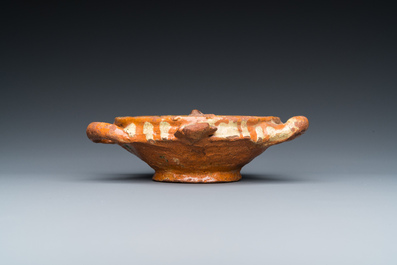 A slip-decorated three-handled earthenware bowl, probably Germany, 16/17th C.