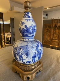 A Chinese blue and white double gourd vase mounted as a lamp, Transitional period