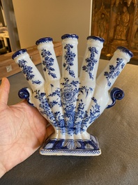 A Dutch Delft blue and white tulip vase with floral design, 18th C.