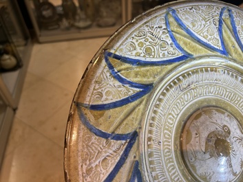 A large Hispano-Moresque lustre-glazed dish with a central bird medallion, Spain, 16th C.