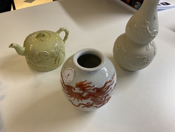 A Chinese yellow-glazed biscuit teapot, a white-glazed biscuit double gourd vase and an iron-red 'phoenix' jar, 20th C.