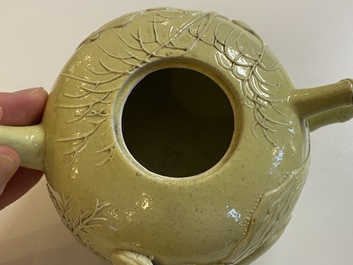 A Chinese yellow-glazed biscuit teapot, a white-glazed biscuit double gourd vase and an iron-red 'phoenix' jar, 20th C.