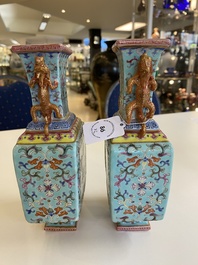 A pair of Chinese famille rose turquoise-ground vases, Qianlong mark, 19/20th C.