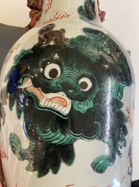 A pair of Chinese polychrome 'Buddhist lions' vases, 19th C.