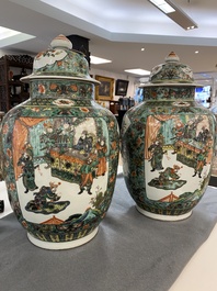 A pair of  Chinese famille verte vases and covers, 19th C.