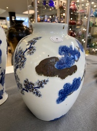 A pair of Chinese blue, white and copper-red vases, a blue and white covered vase and a Canton famille rose box and cover, 19/20th C.