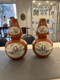 A pair of Chinese coral-ground famille rose double gourd vases, Qianlong mark, Republic