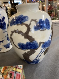 A pair of Chinese blue, white and copper-red vases, a blue and white covered vase and a Canton famille rose box and cover, 19/20th C.