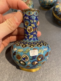 Three Chinese cloisonn&eacute; vases and a covered box, 19/20th C.