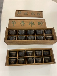 20 Chinese coconut 'Shou' cups in wooden presentation boxes, 19/20th C.