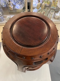 A Chinese wooden drum-form stand or seat, 19/20th C.