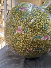 A large Chinese famille rose yellow-ground bottle vase, Qianlong mark, 19th C.