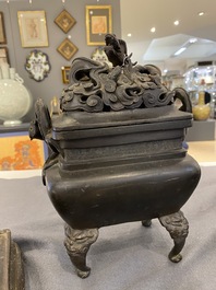 A Chinese bronze censer with reticulated 'dragon' cover on bronze stand, 17th C.