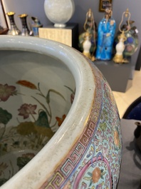 A large Chinese famille rose fish bowl on wooden stand, 19th C.