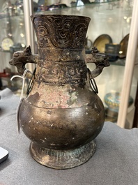 A Chinese ritual bronze 'hu' wine vessel and cover, Eastern Zhou or earlier