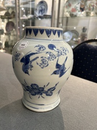 A Chinese blue and white vase with birds among blossoming branches, Transitional period