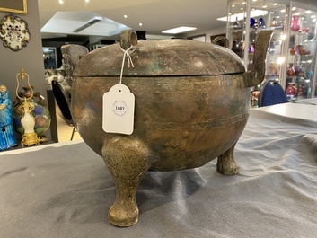 A very large archaic bronze tripod vessel and cover, 'ding', Eastern Zhou period