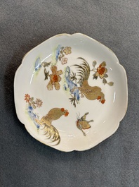 A Chinese grisaille and gilt 'roosters' cup and two saucers, Yongzheng