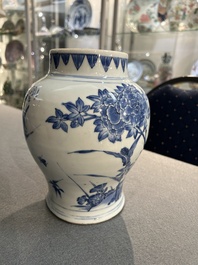 A Chinese blue and white vase with birds among blossoming branches, Transitional period