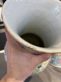 A Chinese famille rose yellow-ground 'phoenix' vase and a large spittoon, 19th C.