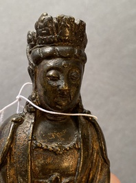 A Sino-Tibetan gilt-lacquered bronze figure of Buddha, late Ming or early Qing