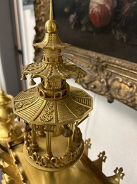 An impressive three-piece gilt bronze chinoiserie clock garniture, France, 19th C.