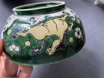 A Chinese verte biscuit 'galloping horses' bowl, Qing