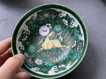 A Chinese verte biscuit 'galloping horses' bowl, Qing