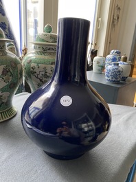 A Chinese monochrome 'sacrificial blue' bottle vase, 18/19th C.