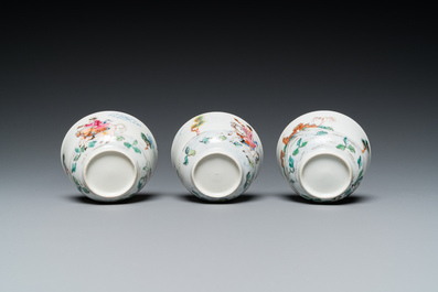 Three Chinese famille rose 'horserider' cups and saucers with the matching tea caddy, Yongzheng/Qianlong