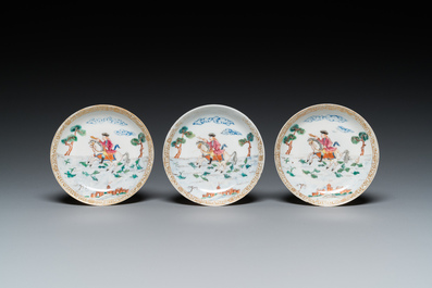 Three Chinese famille rose 'horserider' cups and saucers with the matching tea caddy, Yongzheng/Qianlong