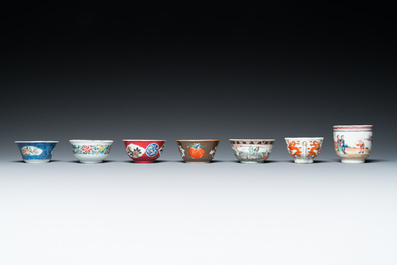 Seven Chinese famille rose cups and seven saucers, Yongzheng/Qianlong