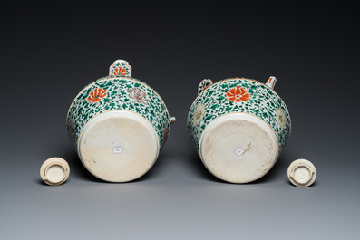 A pair of Chinese famille verte lime pots and covers, Kangxi