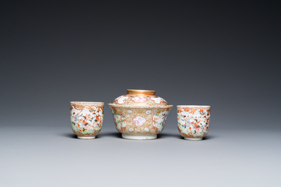 A Chinese famille rose covered bowl, a saucer and two cups with a hunting scene, Qianlong