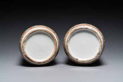 A pair of Chinese Canton famille rose vases and a pair of blue and white covered jars, 19th C.