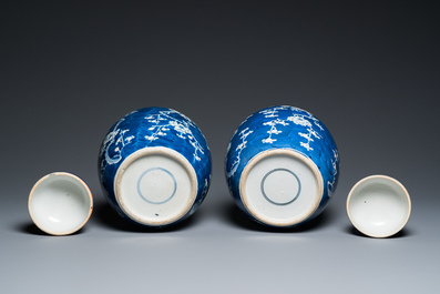 A pair of Chinese blue and white jars and covers, 19th C.