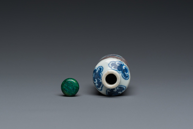 A Chinese blue, white and copper-red 'dragon' snuff bottle, Yongzheng mark, 19th C.