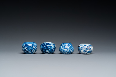 Four Chinese blue, white and copper-red bird feeders, 19th C.