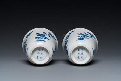 A pair of Chinese blue and white cups and saucers, Chenghua mark, Kangxi