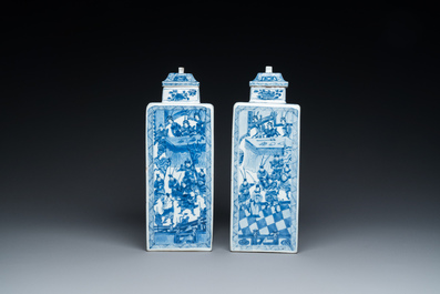 A pair of Chinese blue and white square 'narrative subject' vases and covers, Kangxi