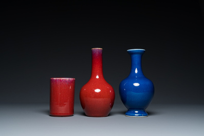 Two Chinese monochrome sang-de-boeuf and powder-blue-glazed vases and a brush pot, 18/19th C.