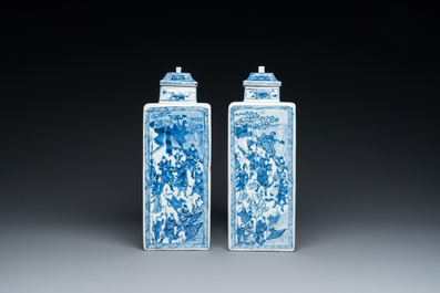 A pair of Chinese blue and white square 'narrative subject' vases and covers, Kangxi