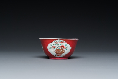 A Chinese famille rose ruby-ground cup and saucer, Yongzheng